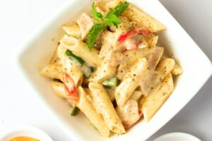 sauced penne pasta dish on bowl